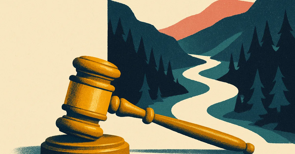 A brass gavel on a river boulder in a pine-covered mountain canyon, illustrating the question: are prediction markets legal in Idaho?